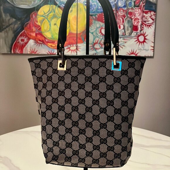 Gucci Handbags - Authentic Gucci Black and Brown GG Canvas Tote with Black Leather Handles